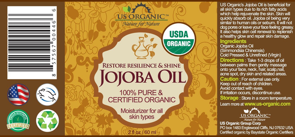 US Organic dropper dispensing golden jojoba oil for precise application