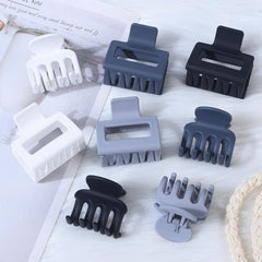 USDNICE clips held in hand to show compact size and easy portability