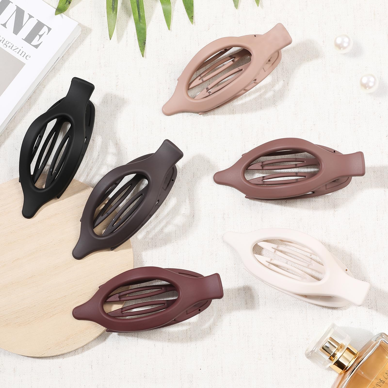 USDNICE close-up of matte oval clip texture showing smooth finish for gentle hair care