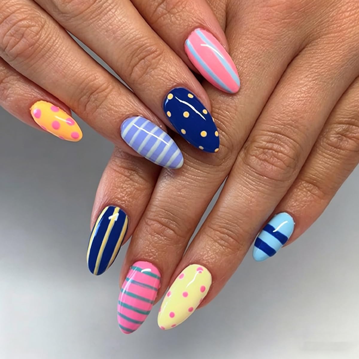 UZJXQ front packaging showing 24 colorful press-on nails benefit quick selection