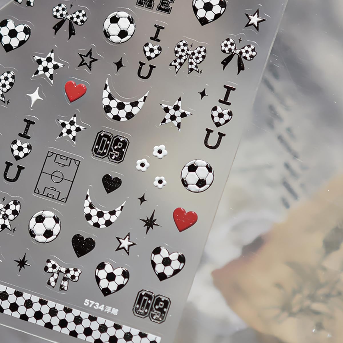 UZJXQ sticker application with tweezers showing precise placement benefit