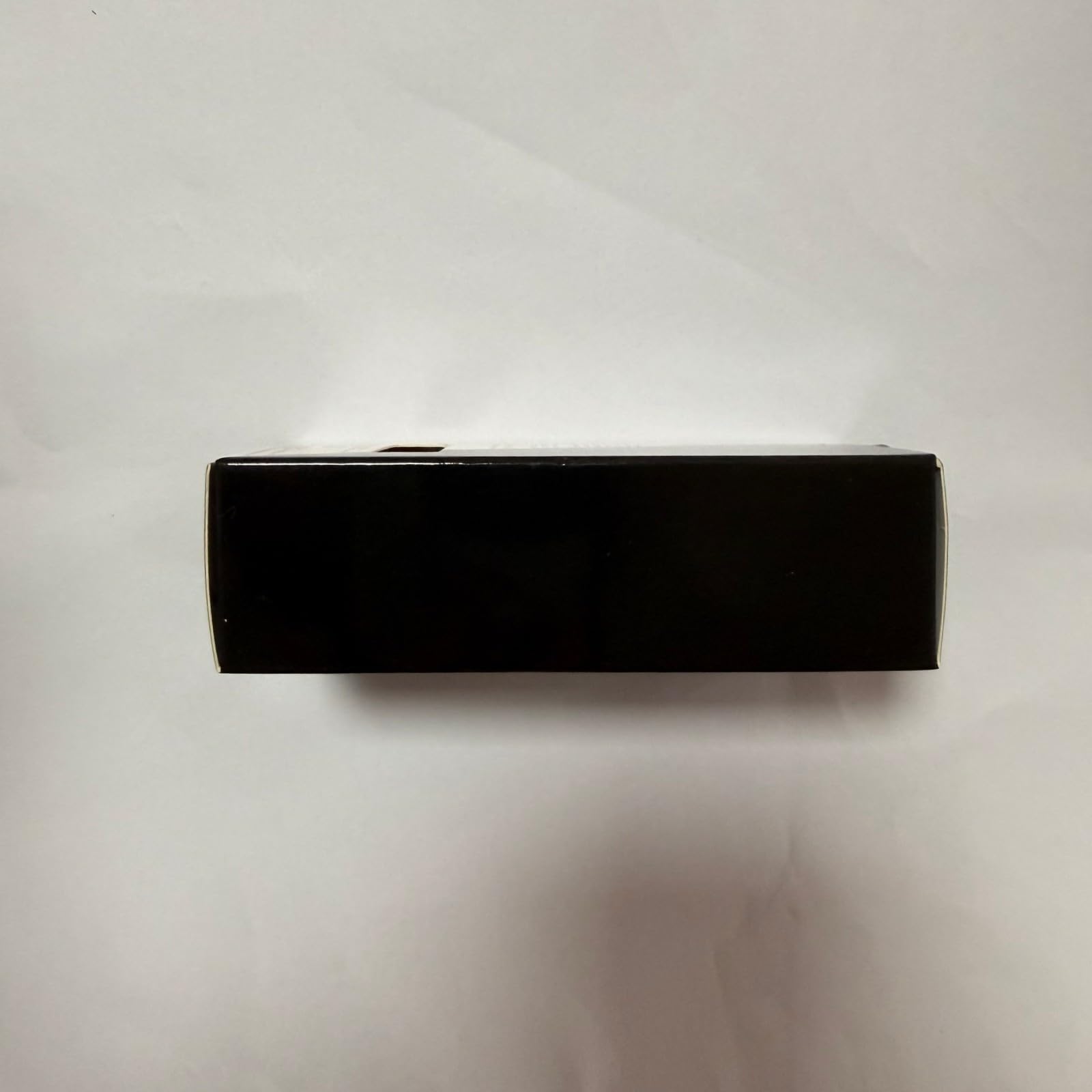 V VENALISA 12ml next to coin showing compact portable bottle size
