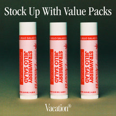 VACATION lip balm applied at beach demonstrating water-resistant protection