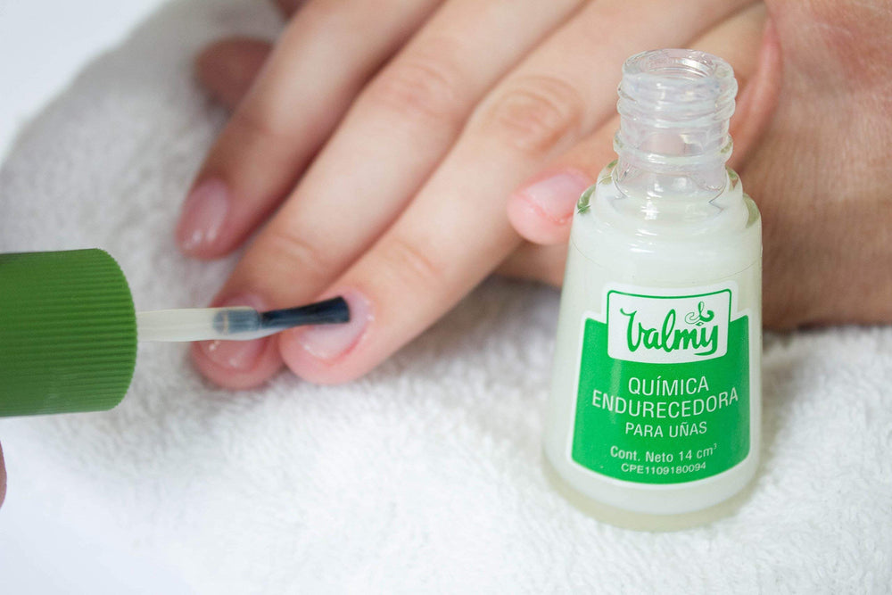 Valmy application in use brush applying polish demonstrating stronger nails benefit