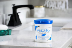 Vanicream jar in hand showing 1 lb scale for long-lasting supply