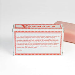 VanMan soap slice beside a coin for size comparison, shows portable weight