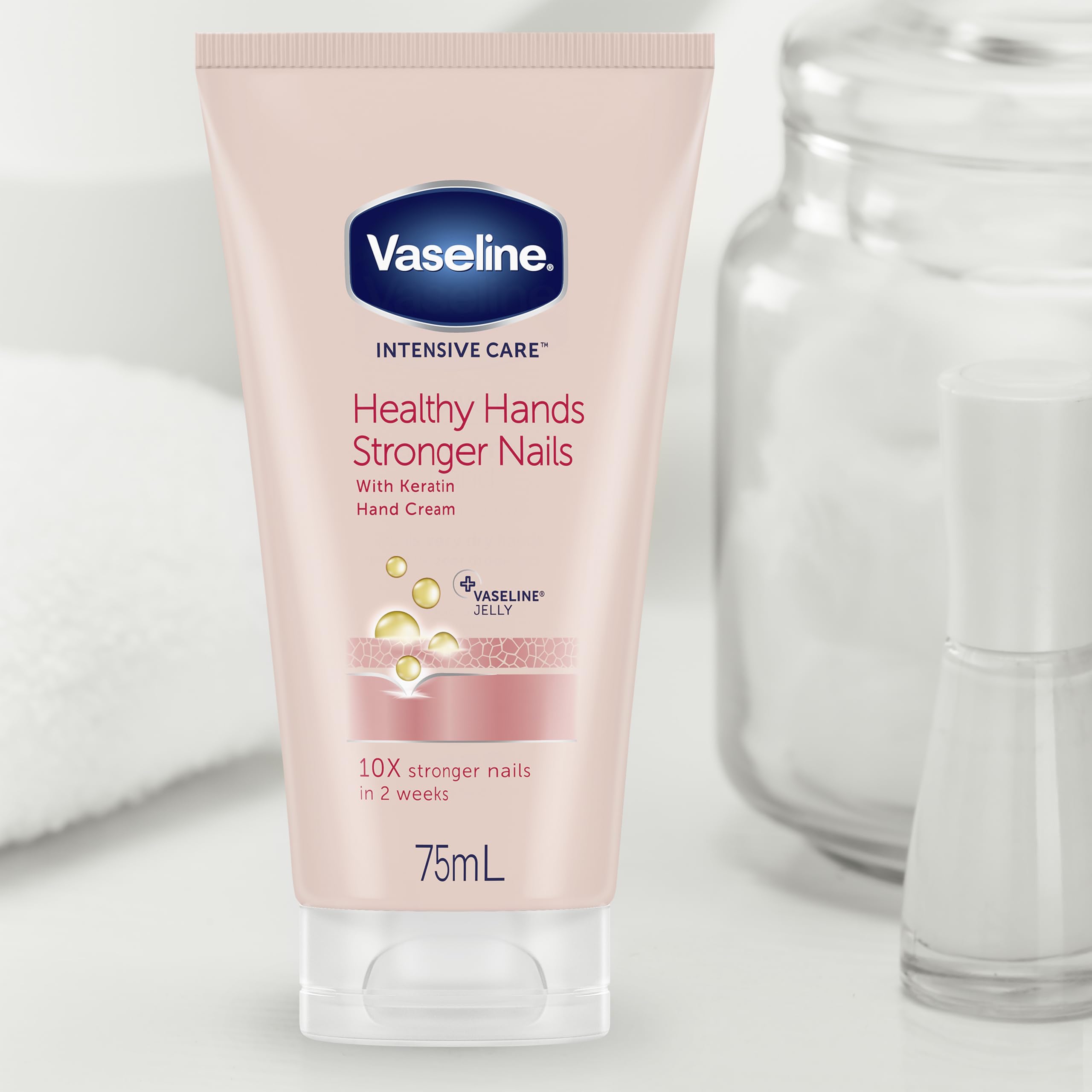 size comparison of Vaseline hand cream tubes beside a hand to show travel-friendly 3.4 oz
