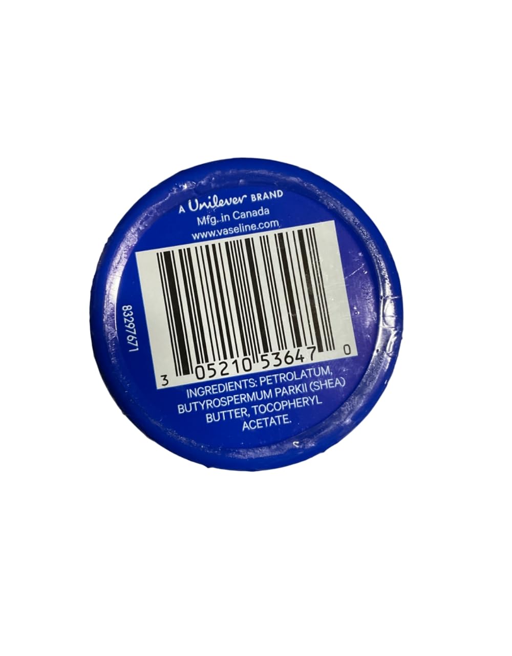 Person applying Vaseline lip therapy from tin showing easy on-the-go hydration benefit