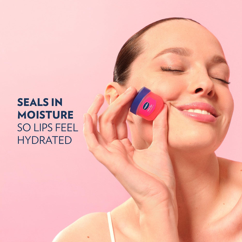 Vaseline open jar with finger applying balm for instant soothing