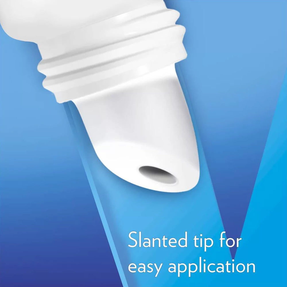 Hand holding Vaseline tubes to show compact size and portability