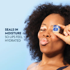 Vaseline jar inside a purse illustrating on-the-go lip care