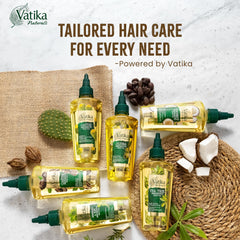 Vatika Curls ingredients display with rosemary and mint highlighting natural extracts