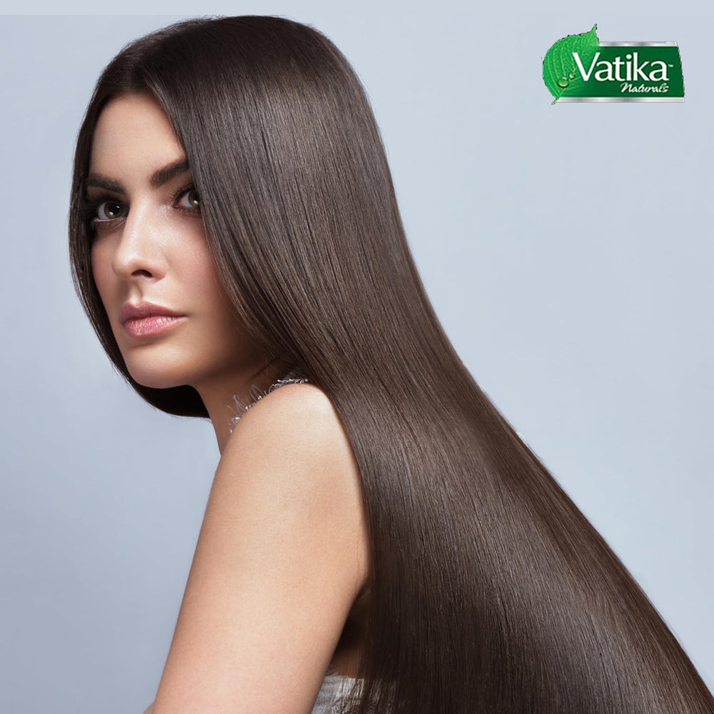 Vatika Naturals application scene massaging oil into scalp improving circulation benefit