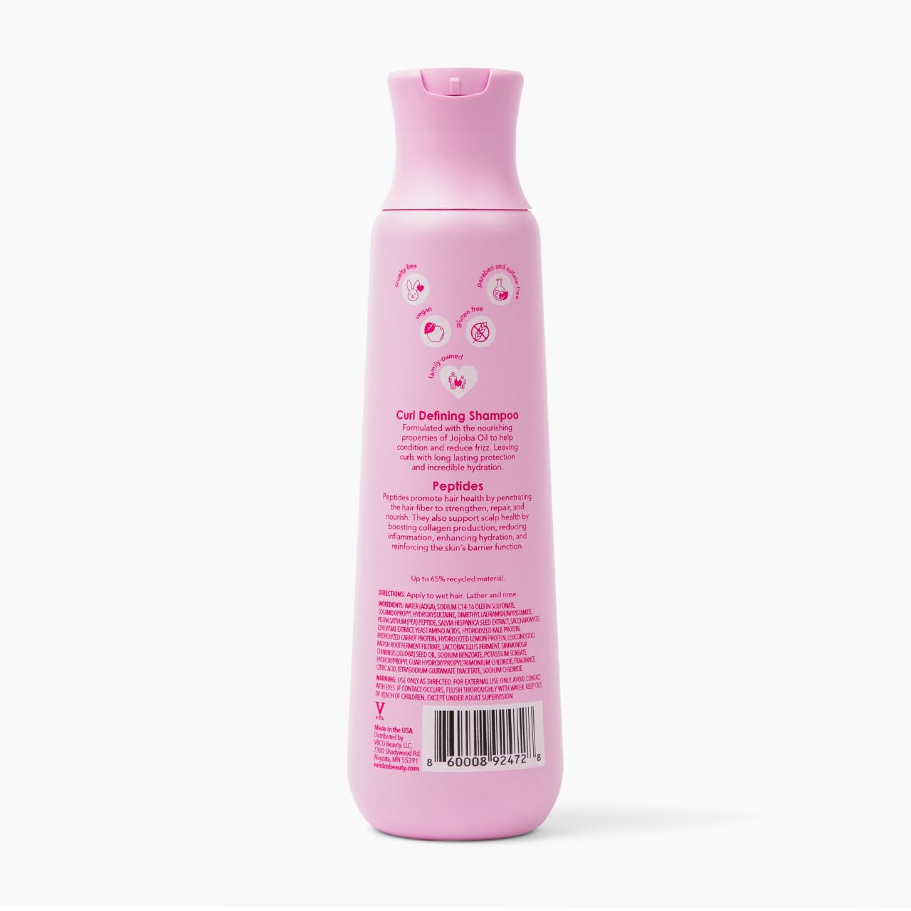 V&CO shampoo on bathroom shelf in styled setting suggesting routine benefit