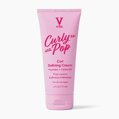 V&CO jar front view showing label and clear branding with benefit of defined curls