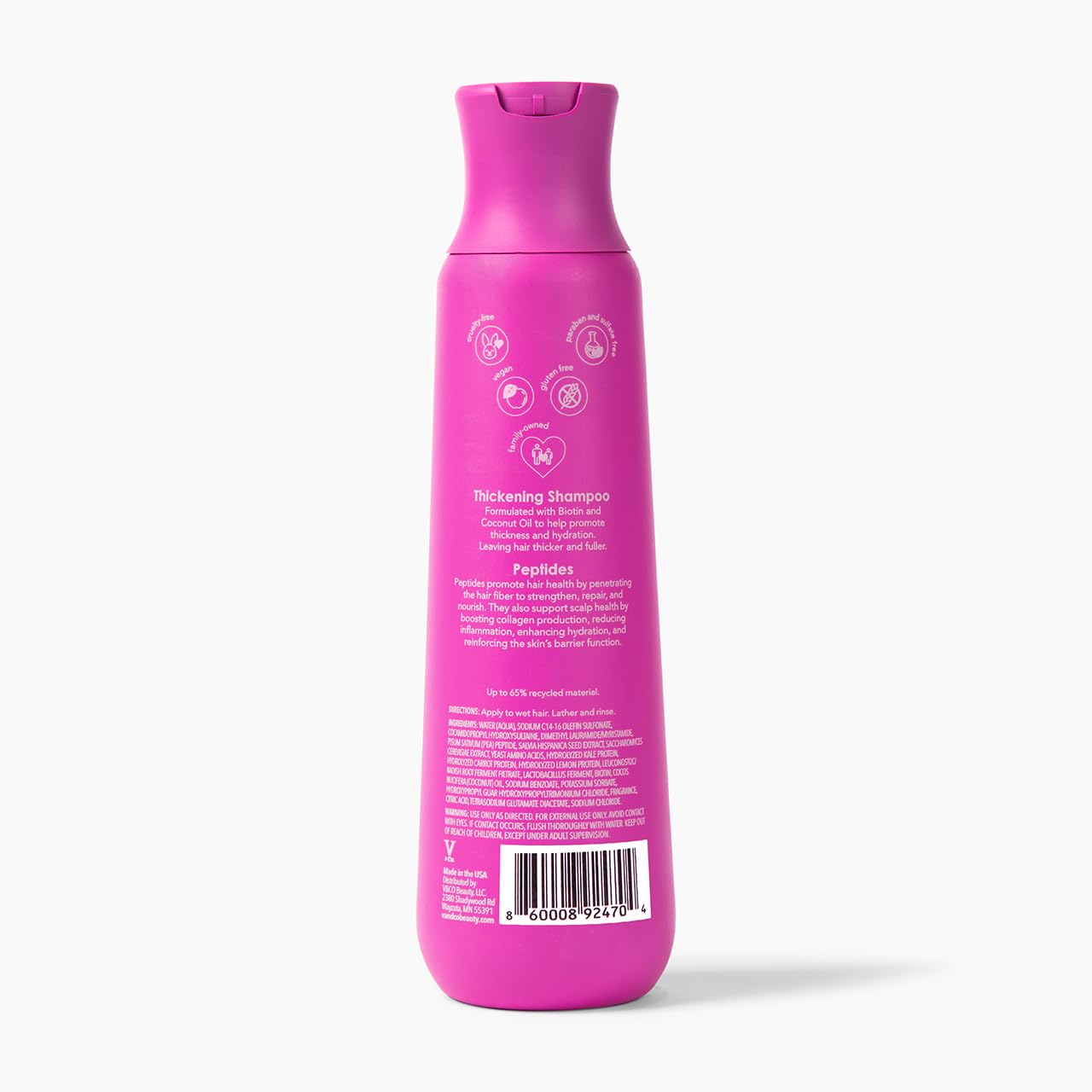 V&Co. shampoo on shower shelf with towel, suggests salon-quality at-home volume