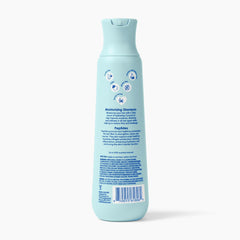 V&CO 12 oz bottle beside hand for size and travel-friendly scale