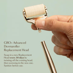 VEGAMOUR dermaroller beside a hand to show size and scale for accurate at-home handling
