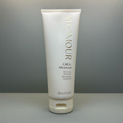 VEGAMOUR bottle staged on bathroom shelf showing routine-ready benefit