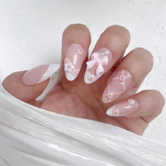 VELINNA lifestyle shot of bridal hand wearing nails for photo-ready style