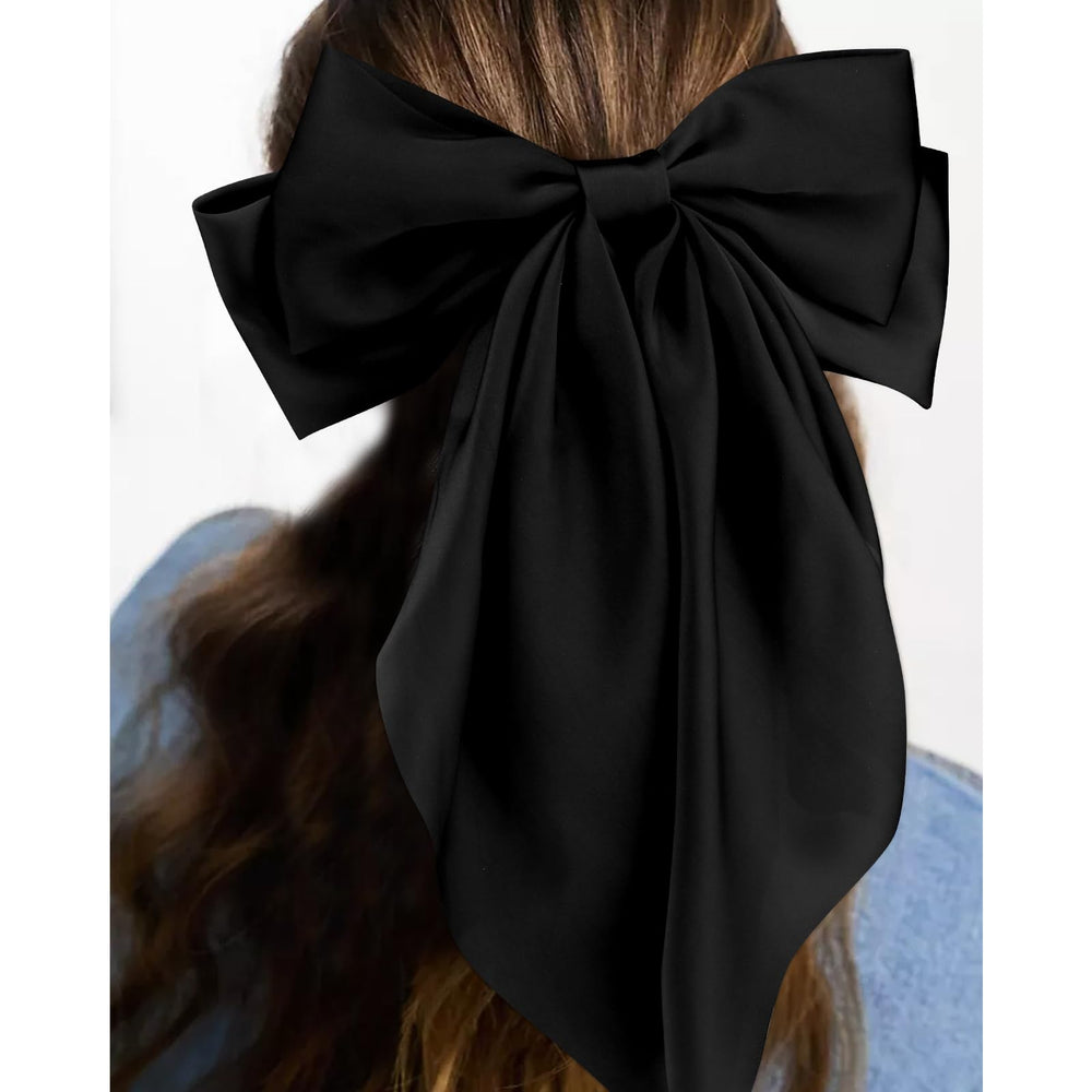 VELSCRUN bow worn in hair side profile demonstrating secure grip and elegant look