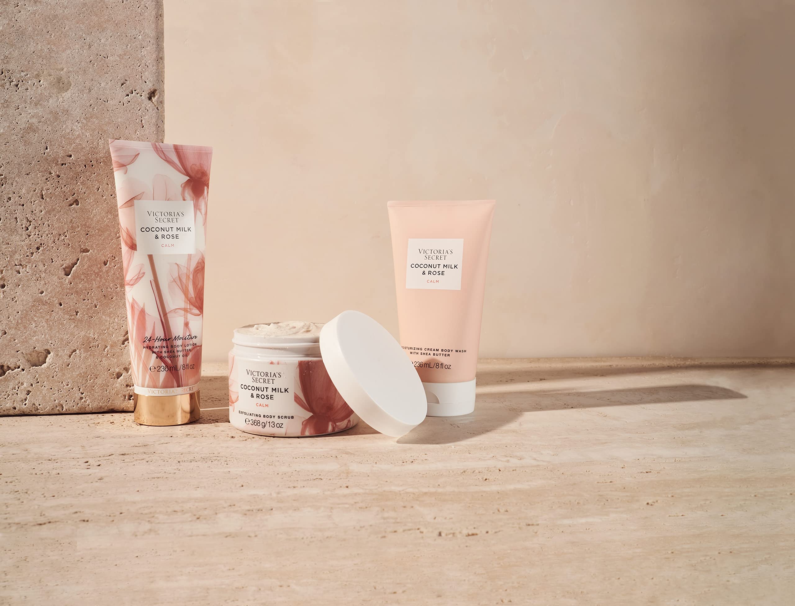 Victoria's Secret applying lotion to hand demonstrating quick absorption benefit