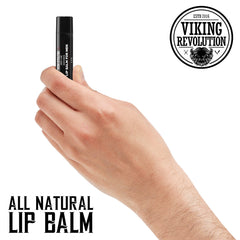 Viking Revolution lip balm held in hand illustrating size and pocket-friendly convenience