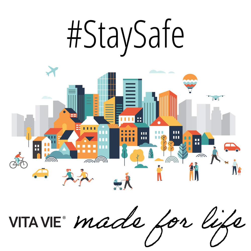 VITA VIE 12 fl oz bottle beside hand to show size and travel convenience
