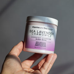 VITAMINS AND SEA BEAUTY jar held in hand to show size and travel-friendly convenience