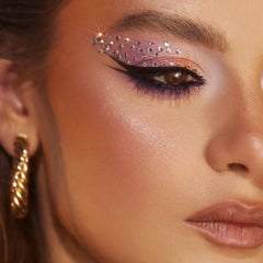 Vivienne Sabó on a vanity with makeup tools showing everyday use benefit