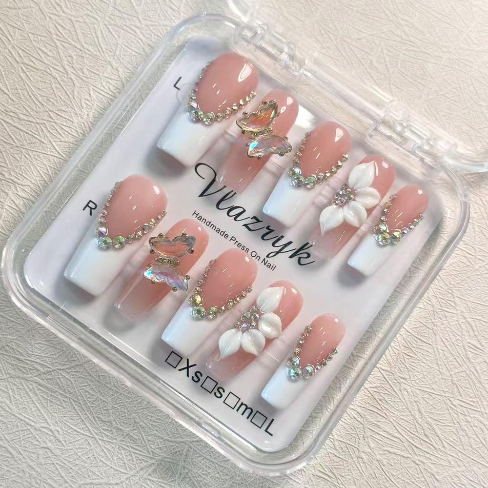 Vlazryk front packaging showing white French tips and elegant presentation