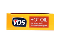 VO5 vial next to a hand illustrating the small travel-size convenience