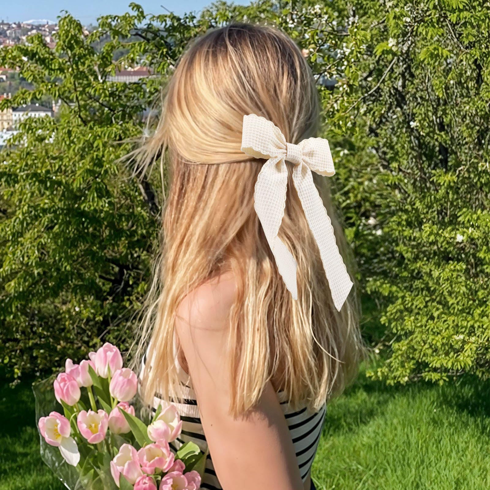 VOBOBE side profile showing long tail movement and feminine flowing silhouette