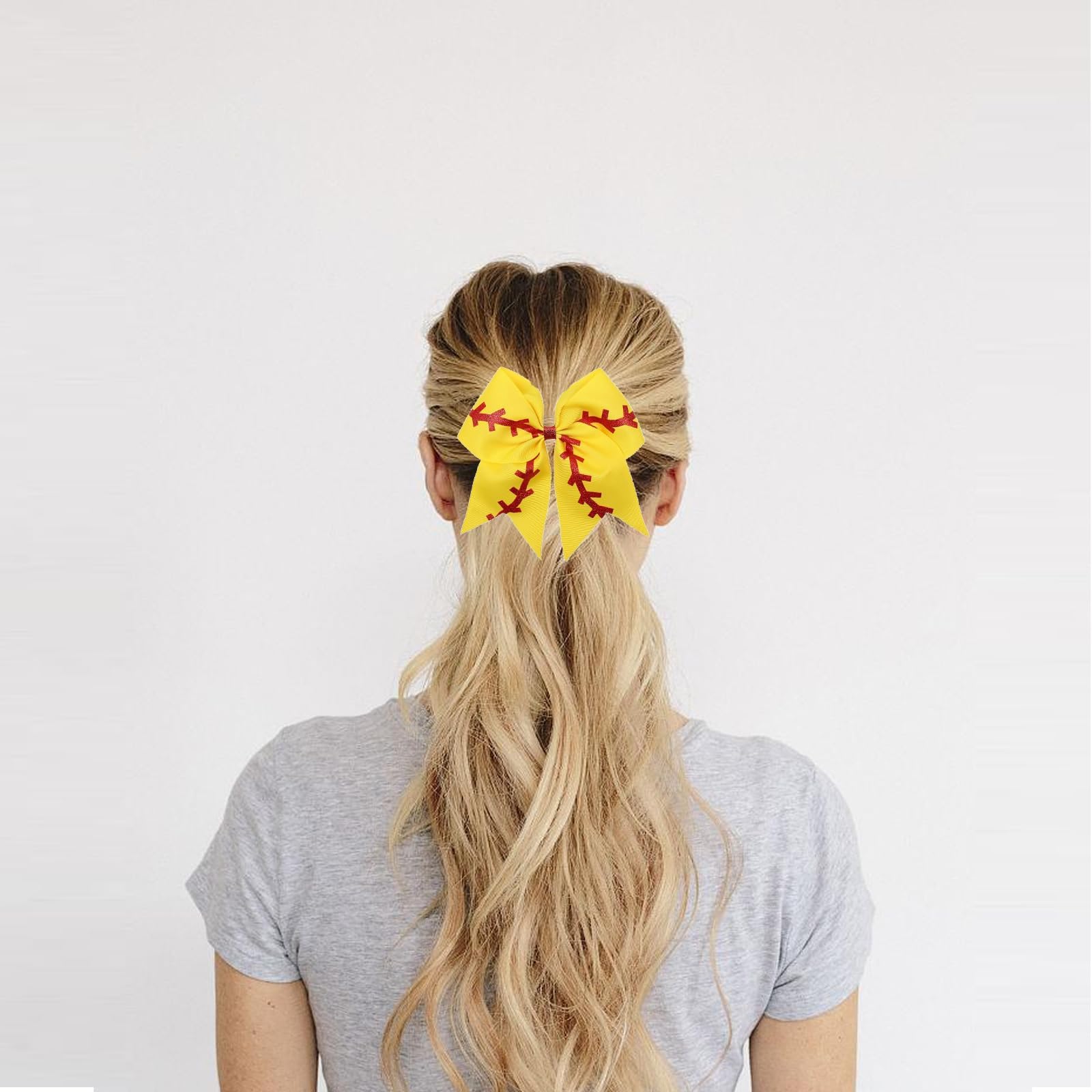 Volwiqu bow worn by cheerleader during game conveying secure fit and motion safety
