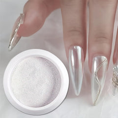 vonrui hand wearing chrome manicure showcasing finished nails and festive metallic look