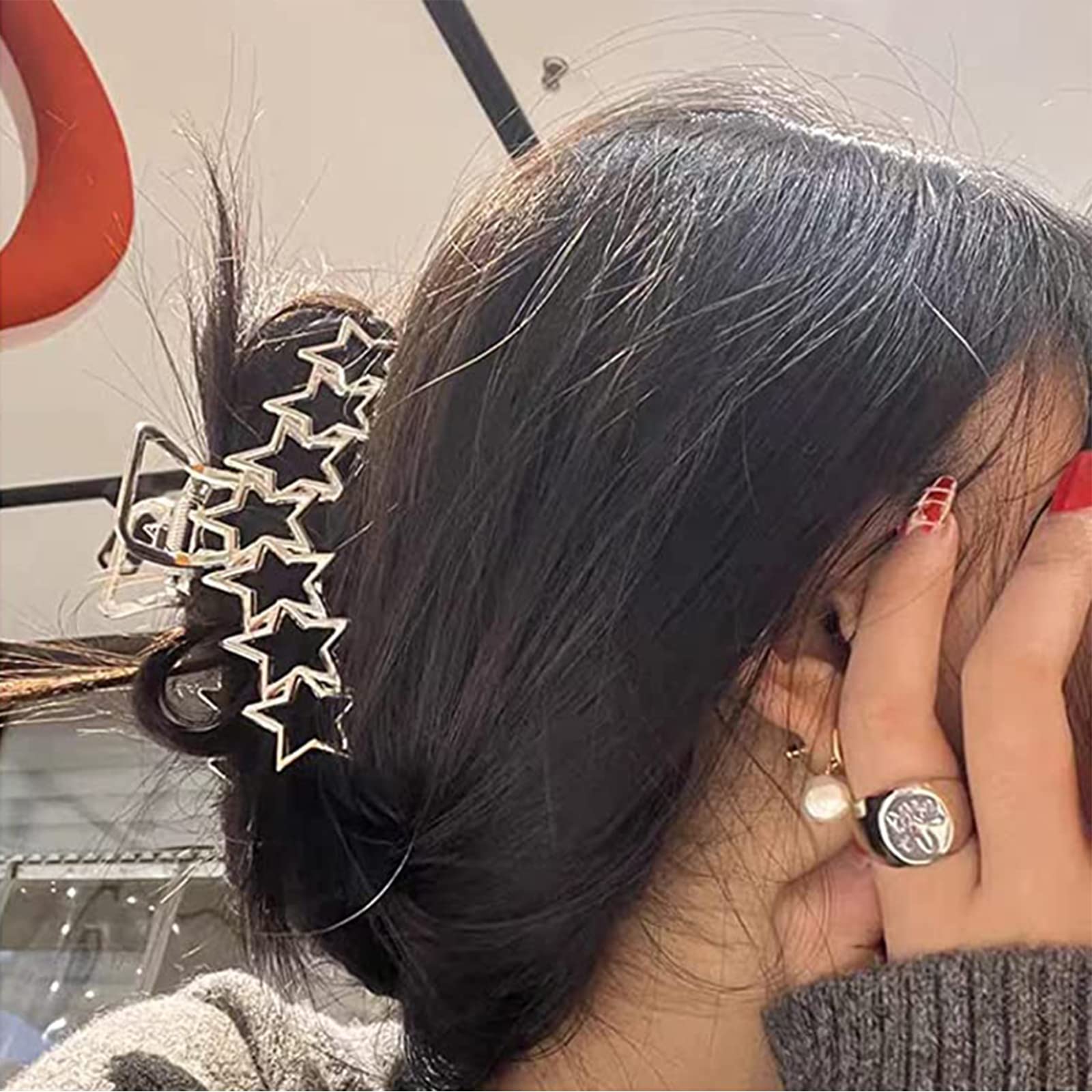 VOTACOS clip in hand to show size and ease of use for quick styling