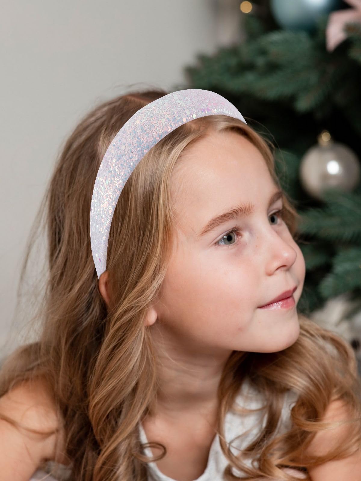 Vovii headband next to ruler showing size and flexible, one-size fit
