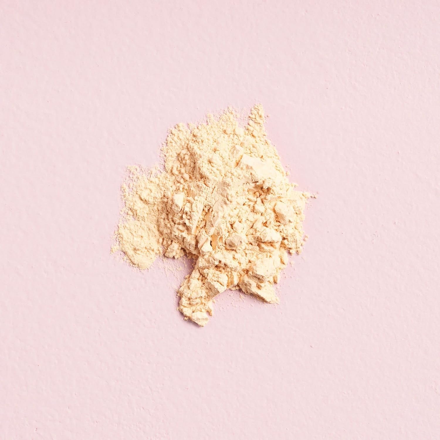 W7 powder pot held in hand showing compact size and travel convenience
