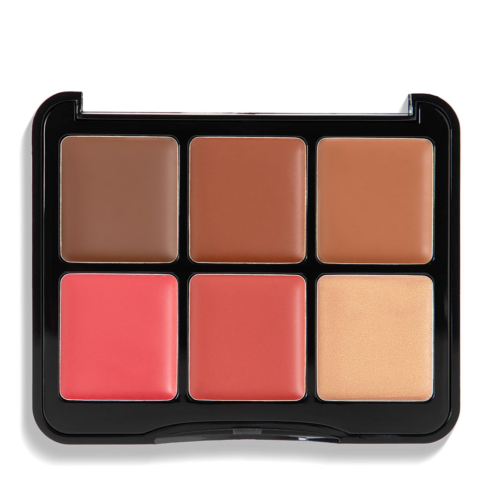 W7 cream swatches on forearm displaying blendable payoff and shade range