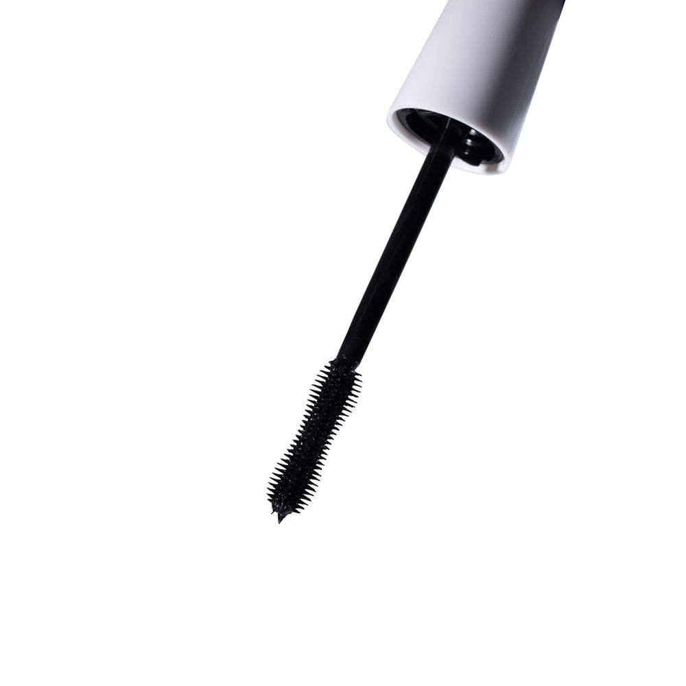 W7 black mascara swatch showing smooth texture and buildable pigment