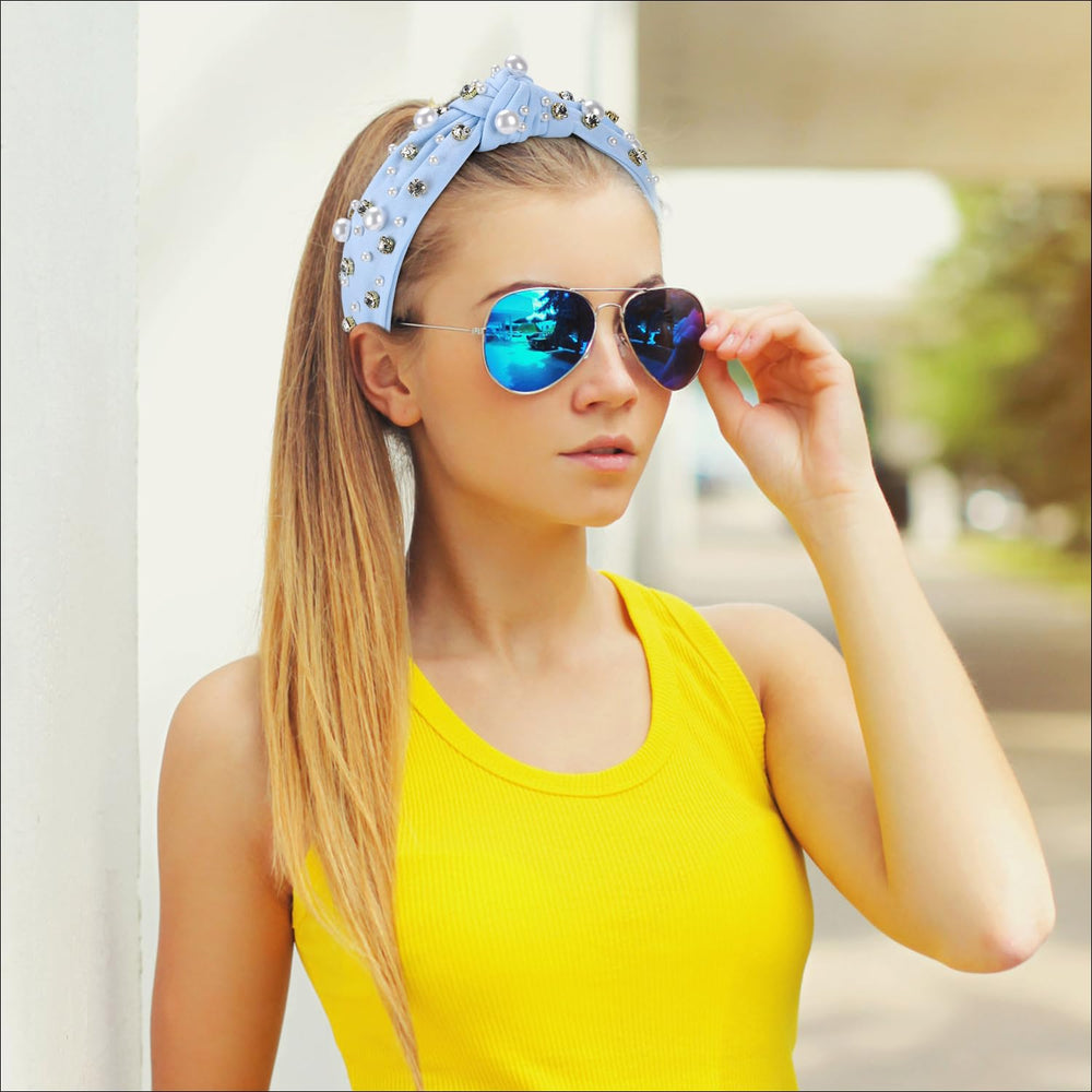 WantGor headband held in hand to illustrate scale and lightweight comfort