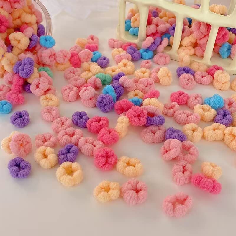 WDGROW stylist putting a tiny scrunchie on baby hair for gentle styling
