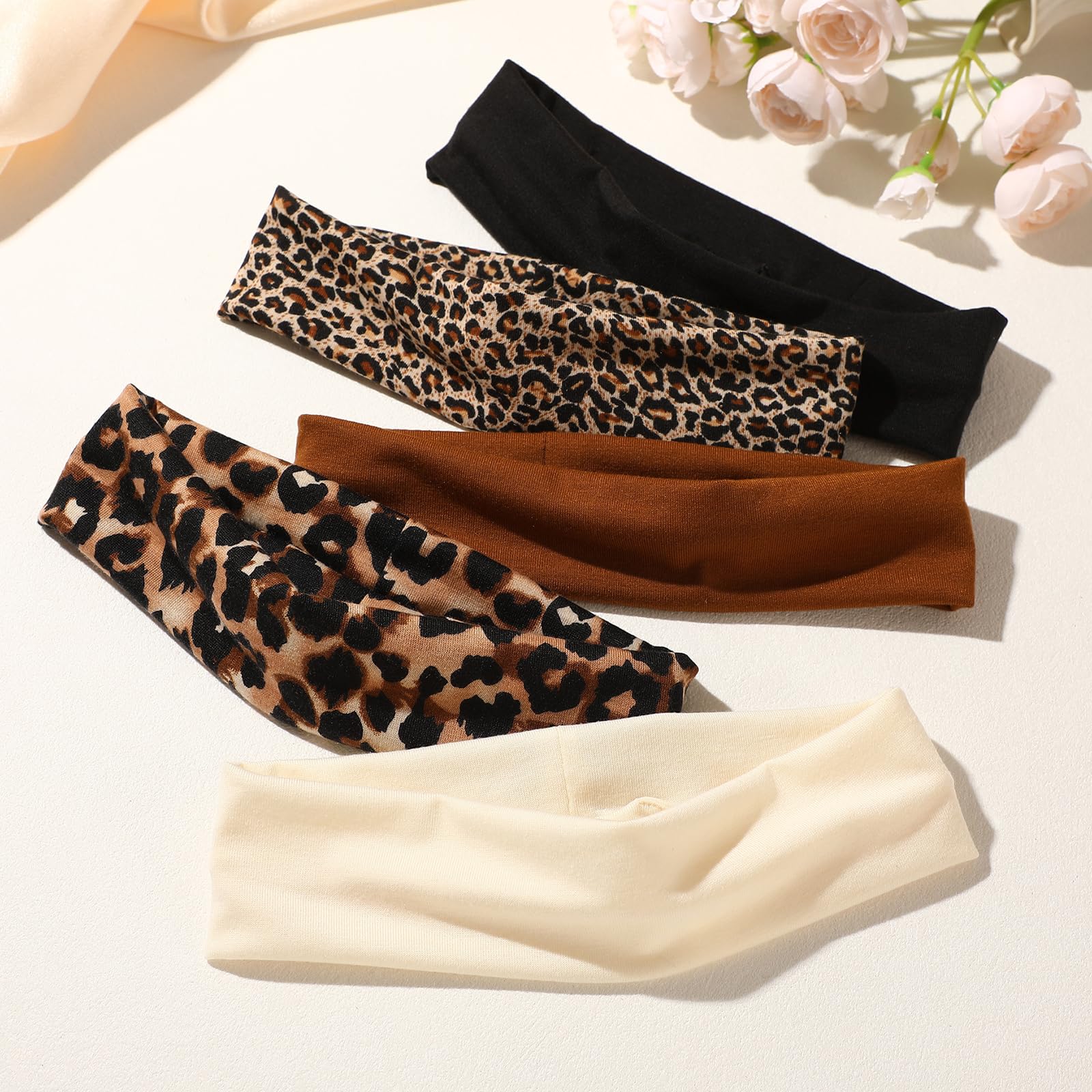 Weazppre headband held in hand to show scale for comfortable fit on various heads