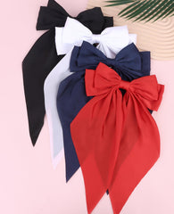 Wecoe bow worn in ponytail lifestyle shot showing added movement and charm