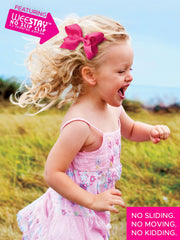 Wee Ones bow in use on toddler showing comfortable fit benefit: stays in place