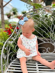 Wee Ones bow size comparison with hand showing small scale benefit: easy wear