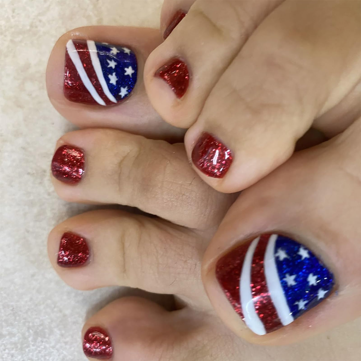 WEIXIWUYU front packaging showing 24 patriotic press-on toenails and accessories for quick styling