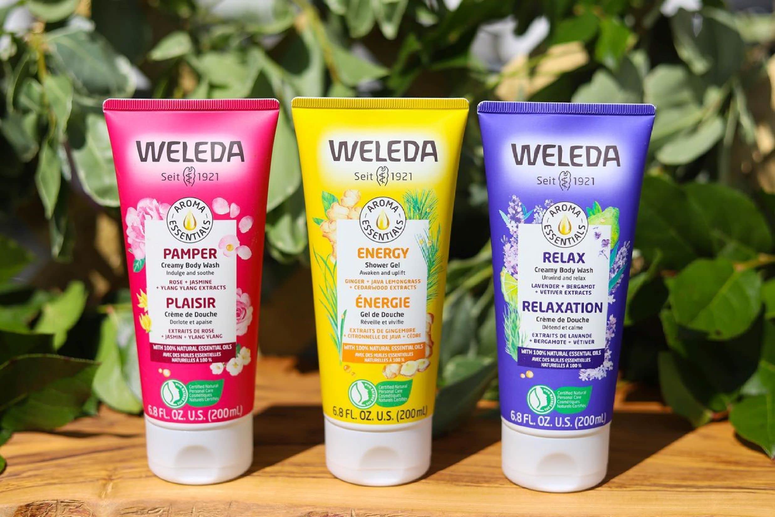 Weleda bottle beside a travel bag highlighting compact, travel-friendly size