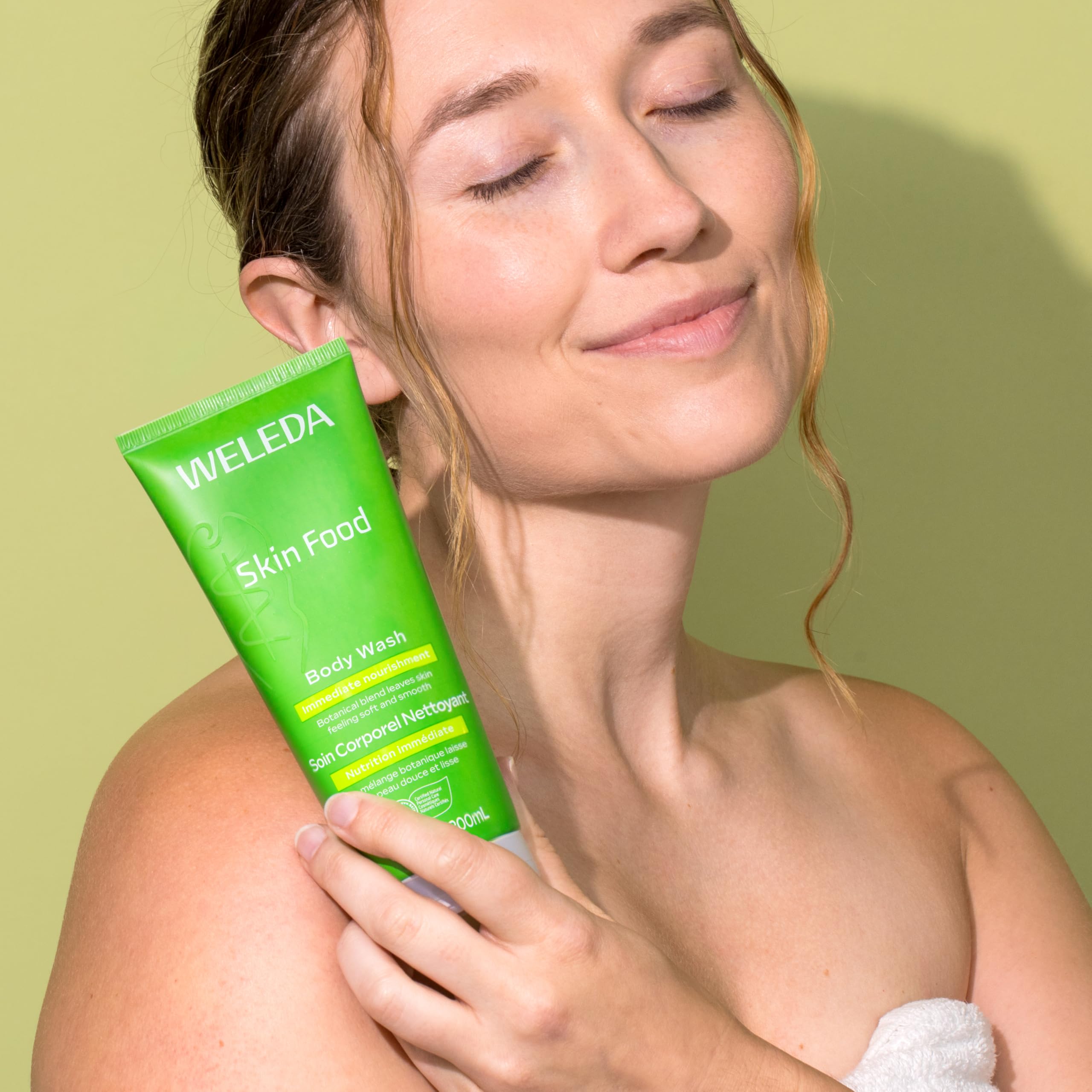 Weleda Skin Food Body Wash creamy lather texture on hand, demonstrates nourishing foam