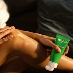 Weleda Skin Food on a vanity setting conveying everyday care and skin-softening benefit